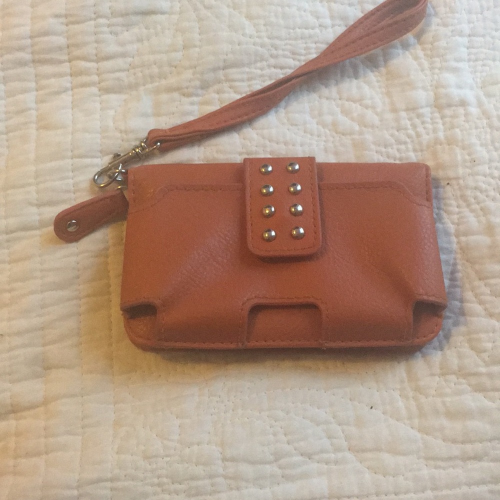 Lightly used orange wristlet
